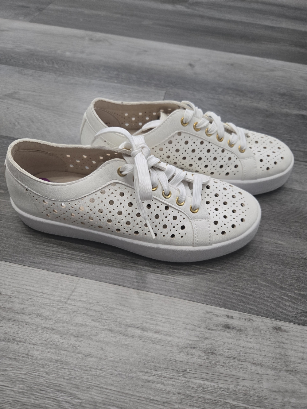 Dolce Vita Roxane perforated white sneakers featuring gold eyelet